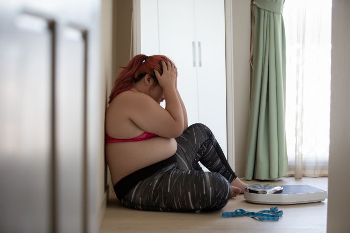 Žena s nadváhou v depresii